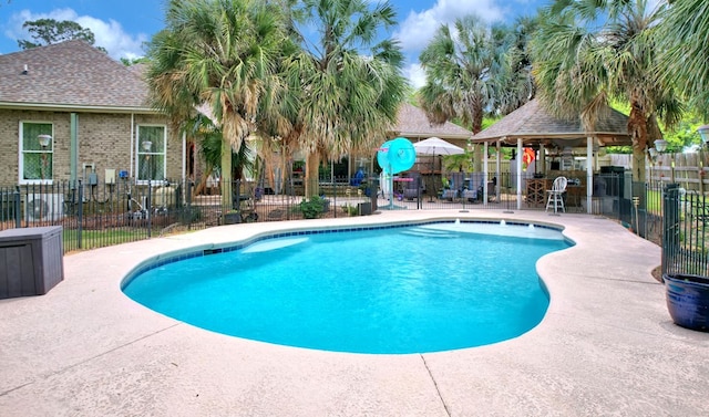 pool with fence and a patio area