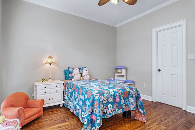 bedroom with ceiling fan, baseboards, crown molding, and wood finished floors