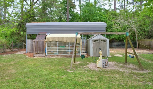 view of yard featuring a fenced backyard, an outbuilding, and a storage shed