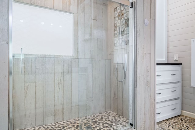 full bath with tile patterned flooring and a stall shower