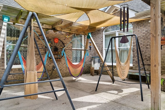 view of play area featuring a pergola