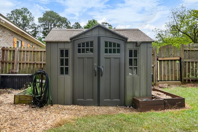 view of shed with fence