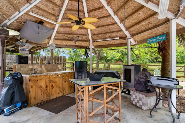 view of patio featuring a gazebo, fence, and ceiling fan