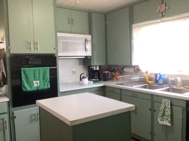 kitchen featuring green cabinetry