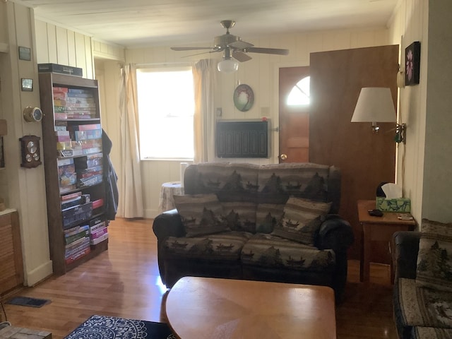 living area featuring ceiling fan and wood finished floors