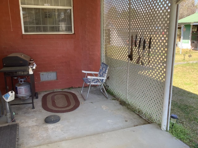 view of patio featuring visible vents and area for grilling