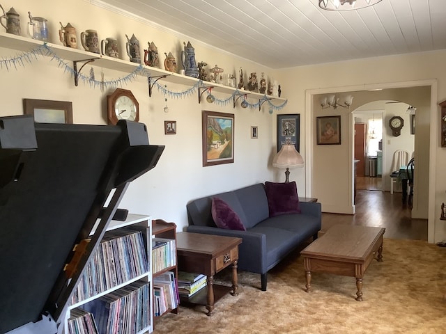 living room featuring wood ceiling, arched walkways, and wood finished floors