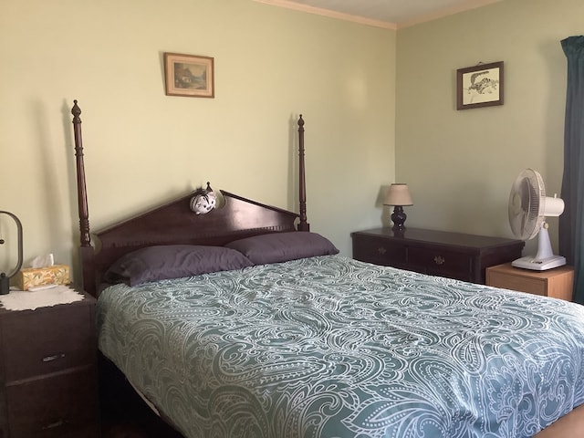 bedroom with ornamental molding