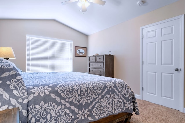 bedroom with lofted ceiling, carpet floors, and ceiling fan