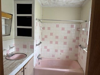 bathroom featuring vanity and tub / shower combination