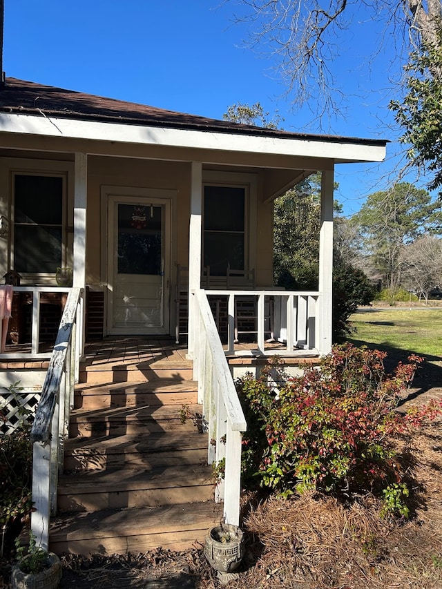 doorway to property featuring covered porch