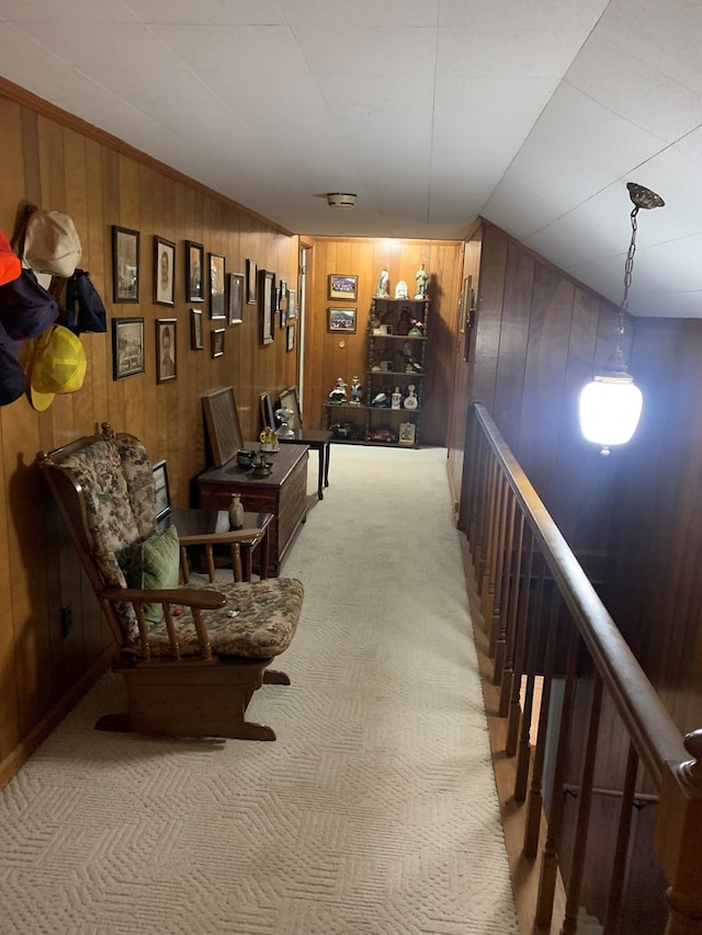 hall with carpet and an upstairs landing