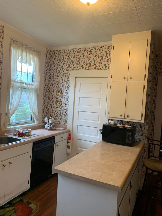 kitchen with wallpapered walls, white cabinets, dark wood-type flooring, light countertops, and black appliances