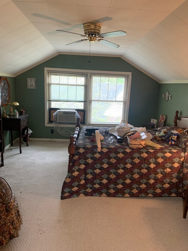 carpeted bedroom featuring cooling unit, vaulted ceiling, and ceiling fan