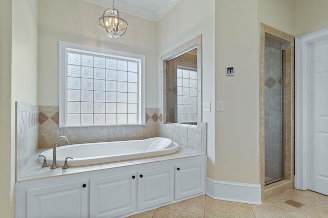 bathroom with crown molding, an inviting chandelier, tile patterned floors, and shower with separate bathtub