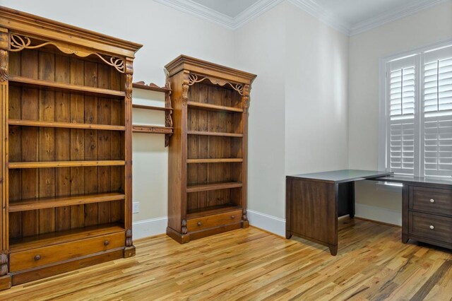 unfurnished office featuring light hardwood / wood-style flooring and ornamental molding