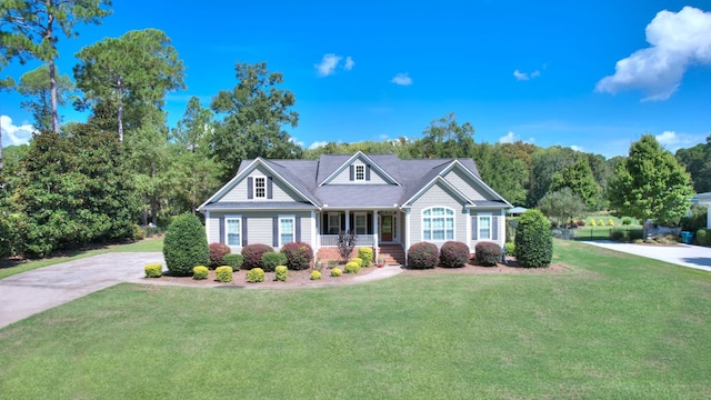 view of front of property with covered porch and a front lawn