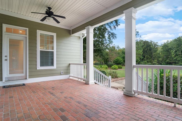 view of patio with ceiling fan and a porch