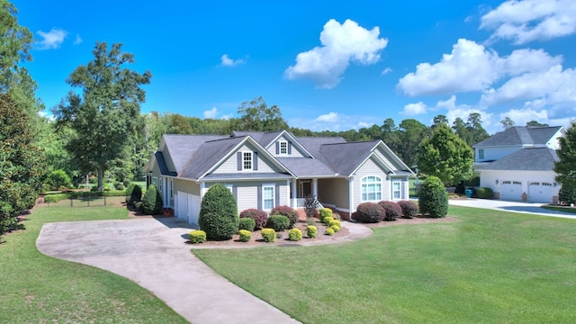 view of front of property with a garage and a front yard