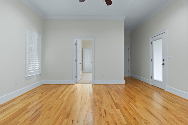 empty room with ceiling fan, light hardwood / wood-style flooring, and crown molding