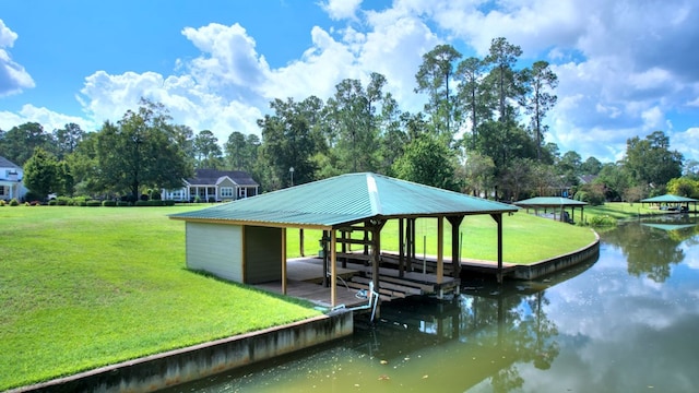 view of dock with a water view, a gazebo, and a yard