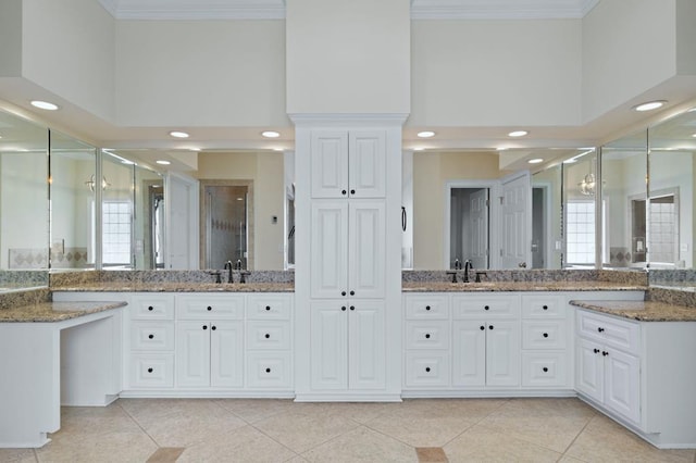 bathroom featuring a towering ceiling, an enclosed shower, and vanity