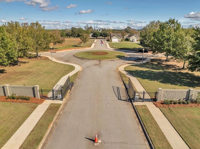 view of property's community with a yard