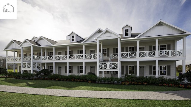 view of front of property with covered porch and a front lawn