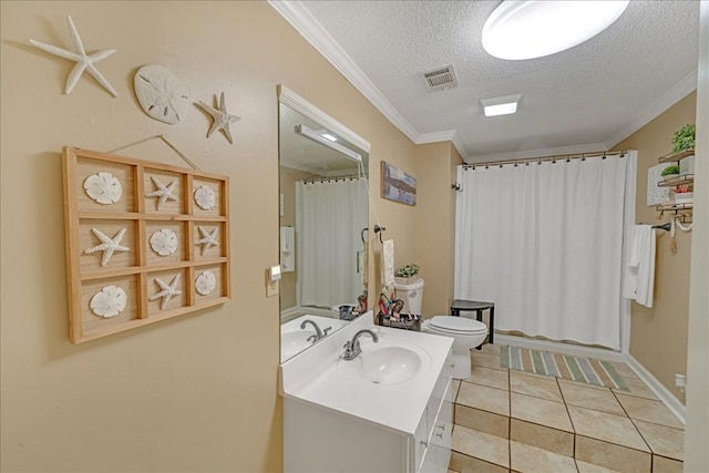 bathroom featuring crown molding, tile patterned floors, vanity, and a textured ceiling