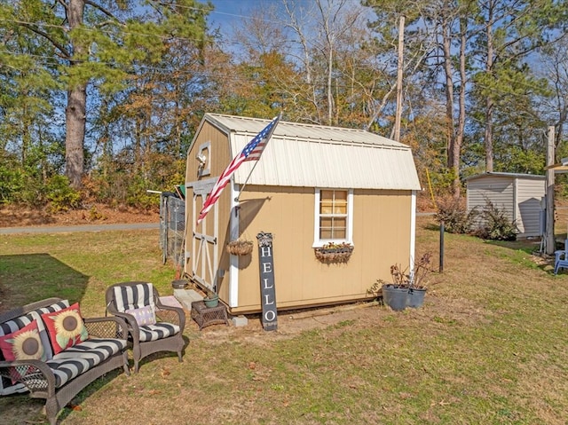 view of outdoor structure featuring a lawn