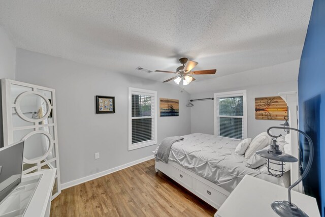 119A-B Tommy Warren Dr, Cobb, GA 31735 - bedroom featuring a textured ceiling, wood finished floors, and ceiling fan