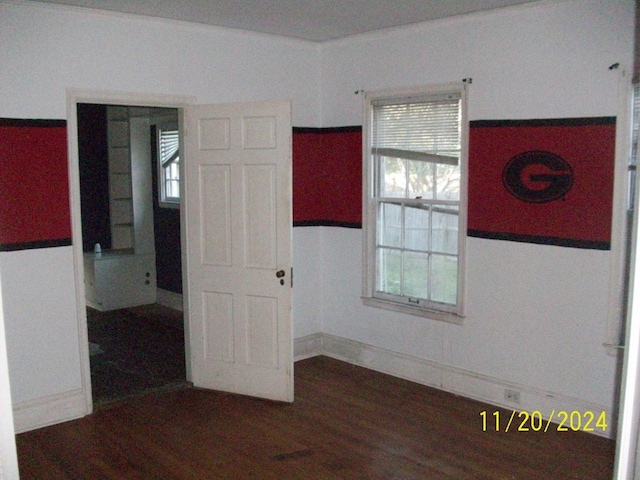 empty room featuring dark hardwood / wood-style flooring