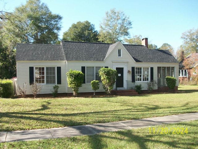 ranch-style house with a front lawn