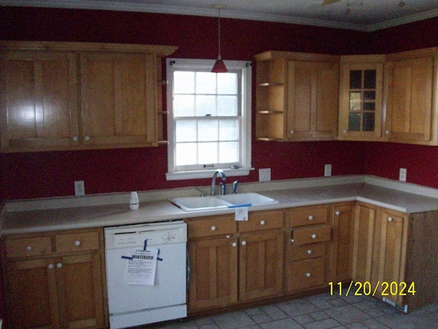 kitchen featuring sink, decorative light fixtures, and white dishwasher