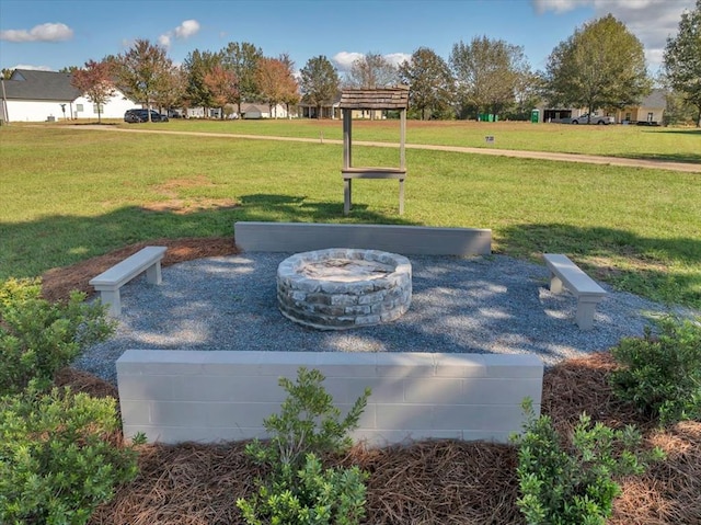 view of yard with a fire pit