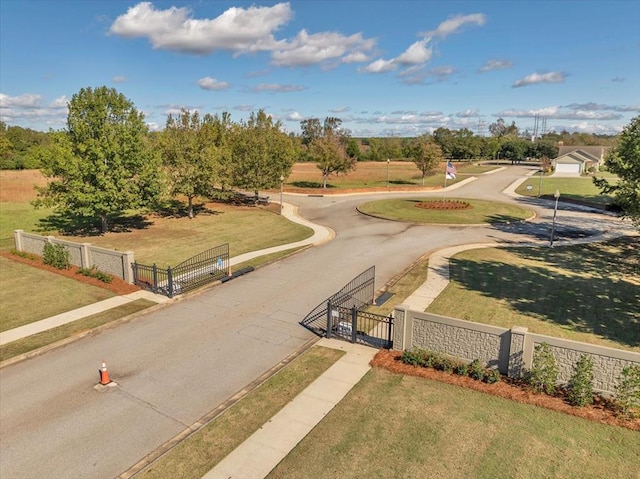 view of home's community with a lawn