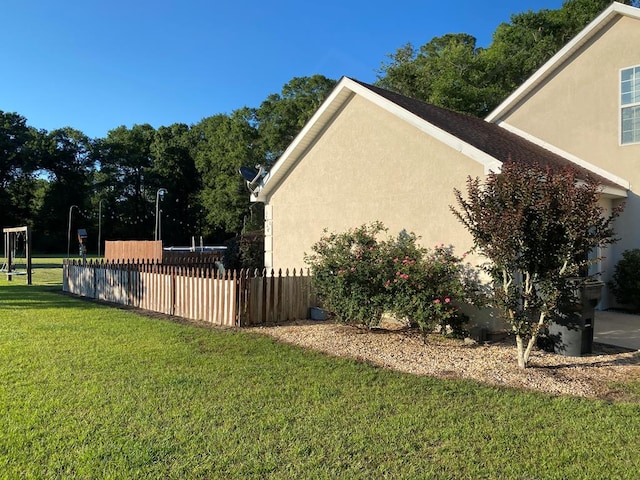 view of home's exterior with a yard