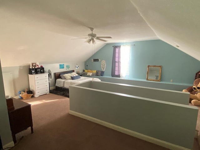 carpeted bedroom featuring ceiling fan and vaulted ceiling