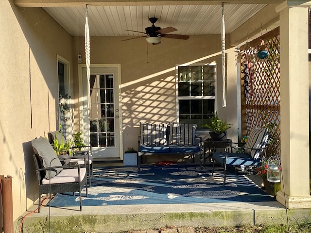 view of patio featuring ceiling fan and a porch