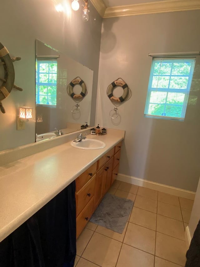 bathroom featuring vanity, tile patterned floors, and ornamental molding