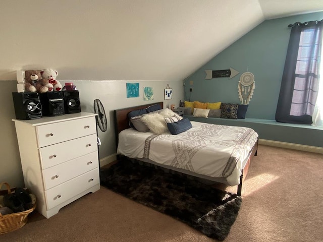 carpeted bedroom with vaulted ceiling