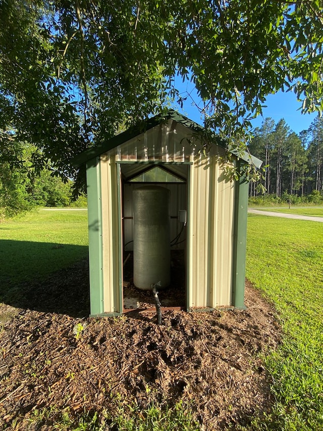 view of outbuilding with a lawn