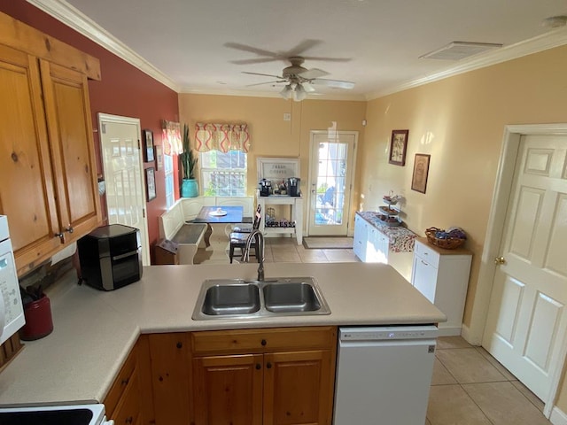 kitchen with ceiling fan, white dishwasher, sink, light tile patterned flooring, and ornamental molding