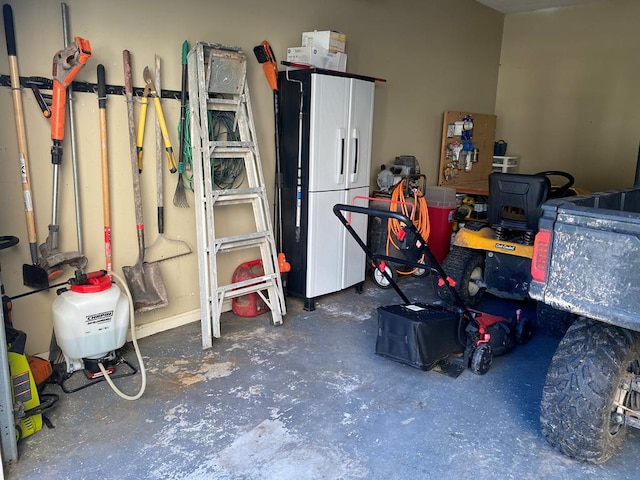 garage with white fridge