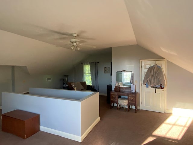 additional living space with ceiling fan, dark carpet, and lofted ceiling