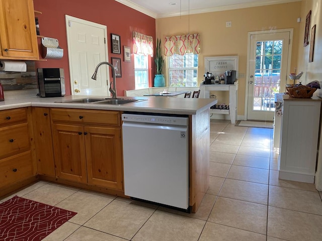 kitchen featuring crown molding, dishwasher, light tile patterned floors, sink, and pendant lighting