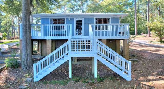 rear view of property featuring a deck