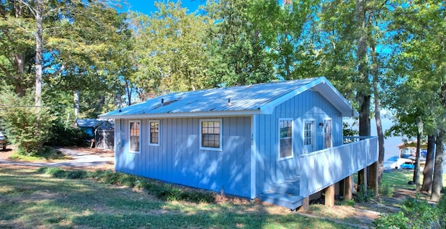 view of property exterior featuring a lawn