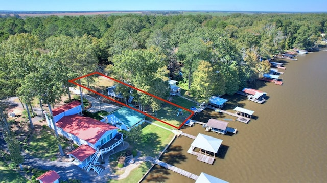 birds eye view of property with a water view