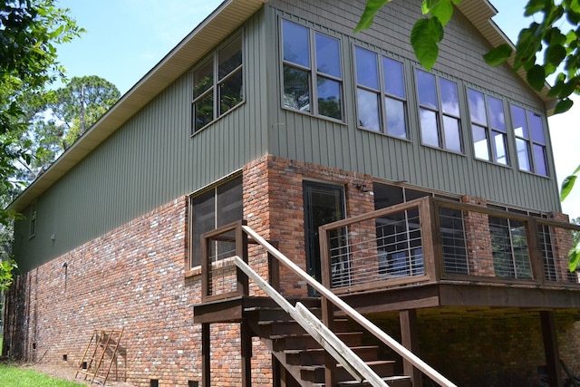 375 Flintside Dr, Cobb, GA 31735 - view of side of property featuring a wooden deck, stairs, brick siding, and board and batten siding